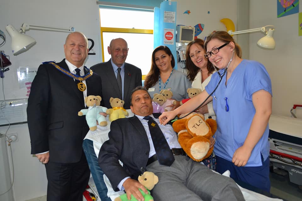 Freemasons and staff with teddies.